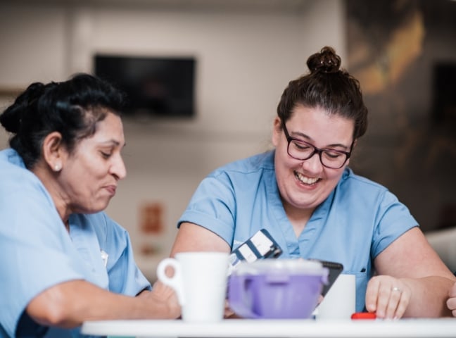 Two nurses smiling on a break