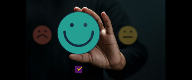 Smiley face emoji in hand