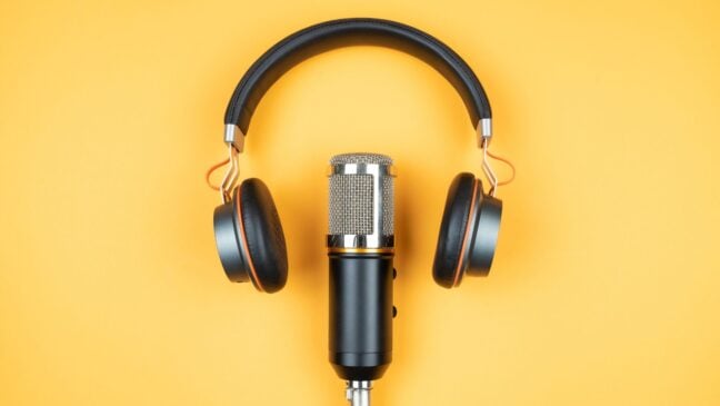 A microphone and headphones on a yellow background